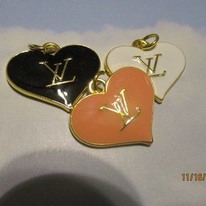 LOUIS VUITTON 3 CHARMS, GOLD TONE, WHITE, BLACK PINK 25X22MM LOT 3